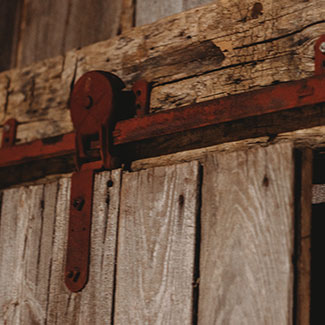 Rustic barn door fittings creating an elegant atmosphere at The Venue at Maloney's in Kaukauna WI.